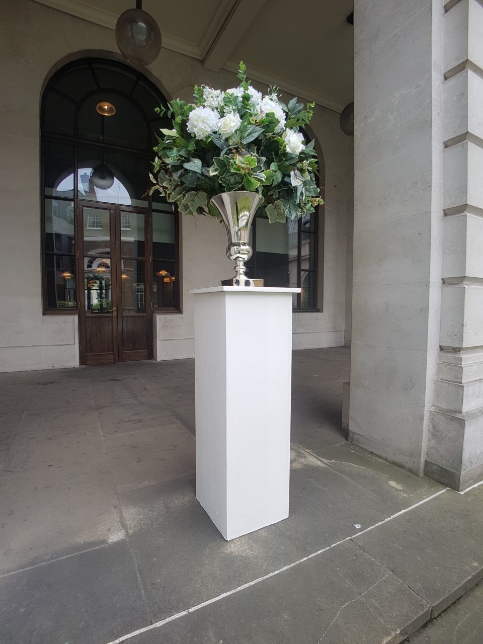 Artificial Flower arrangement into urn